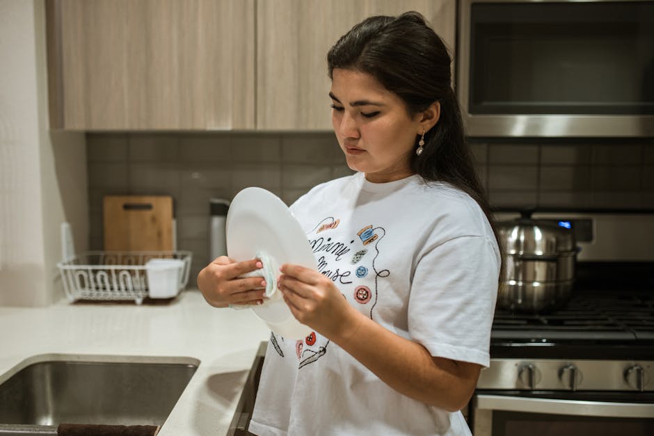 Professional wiping down a kitchen counter